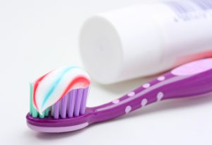 purple toothbrush and multicolored toothpaste to use with Disney Magic Timer app