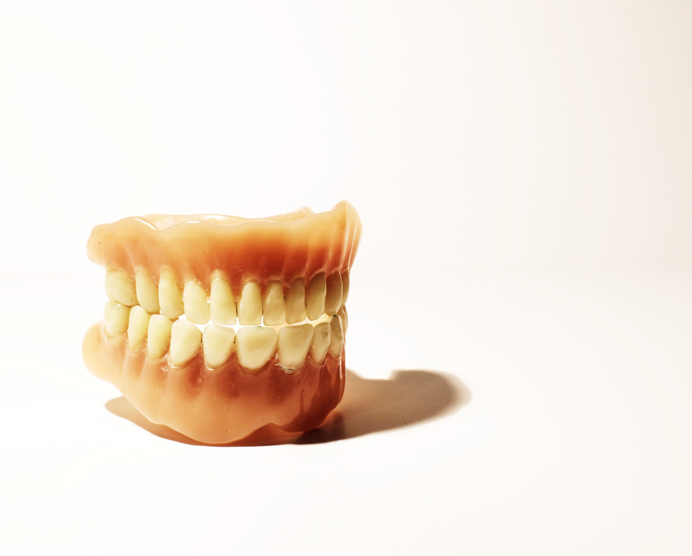 Implants and Your Dentures: What’s the Story?